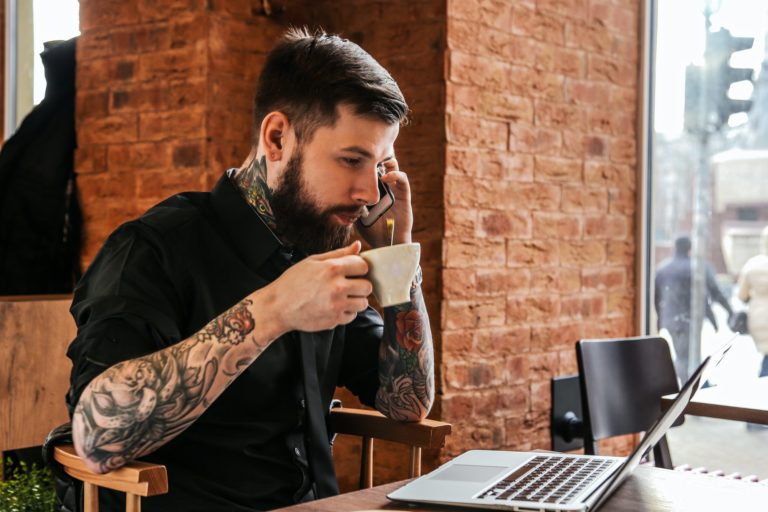 Male with beard in caffe